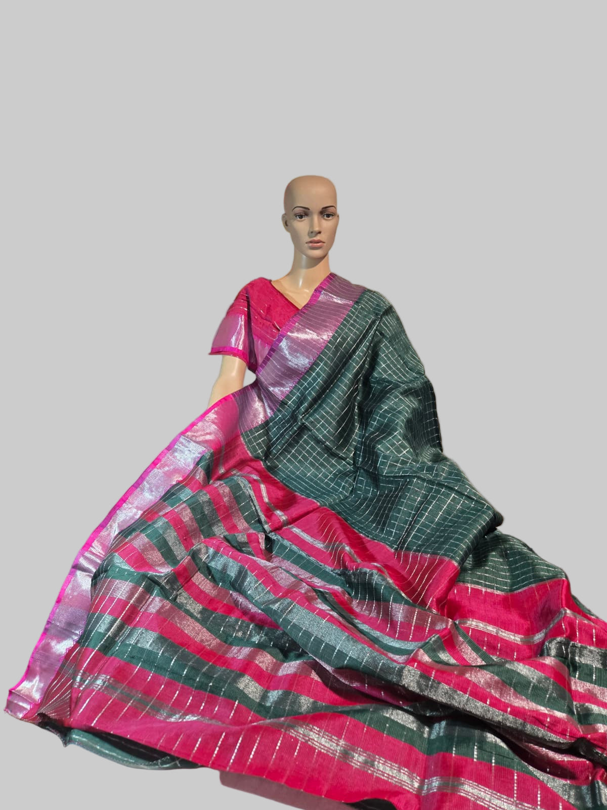 Semi Mangalgiri Silk Check Saree features an elegant allover silver zari checked pattern Bottle Green