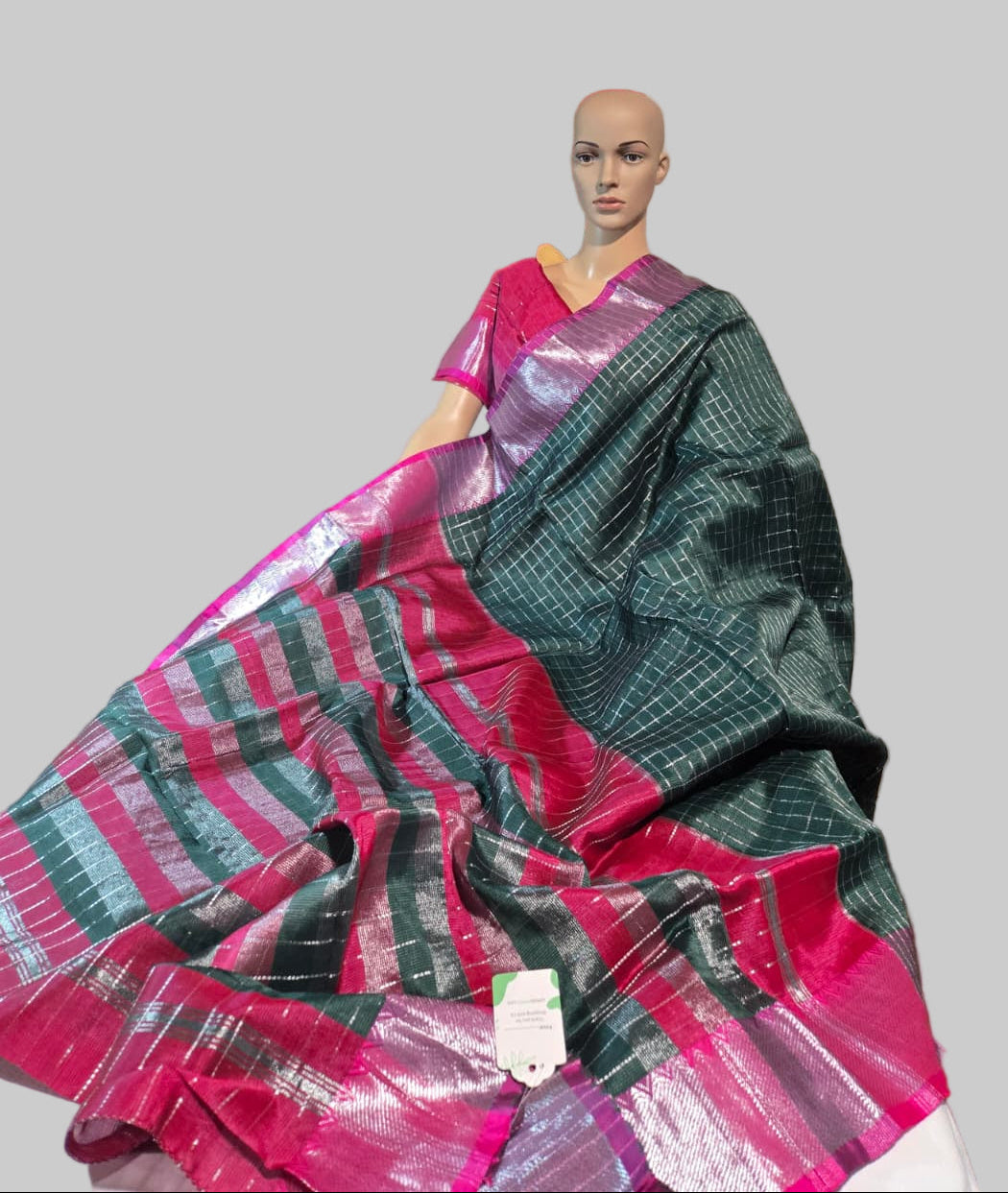 Semi Mangalgiri Silk Check Saree features an elegant allover silver zari checked pattern Bottle Green