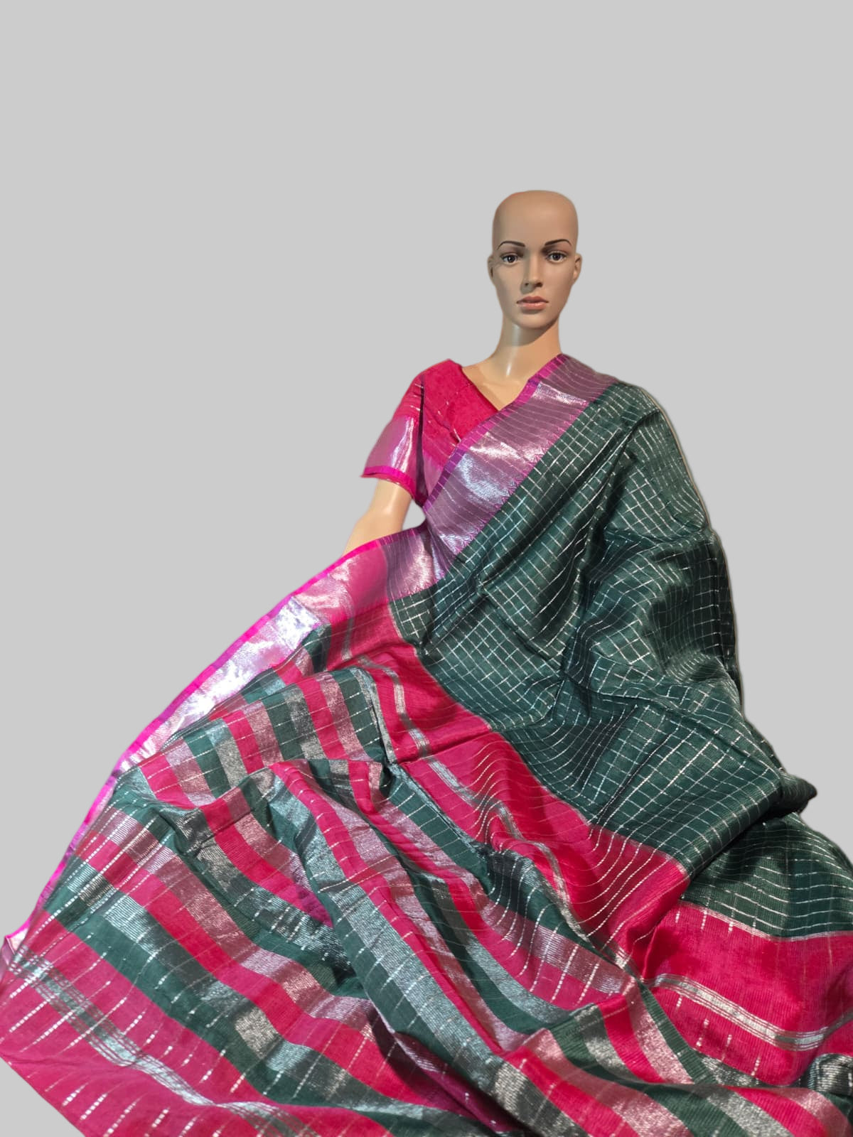 Semi Mangalgiri Silk Check Saree features an elegant allover silver zari checked pattern Bottle Green